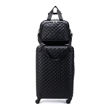 Black quilted leather luggage set with a spinner suitcase and matching travel bag on wheels.