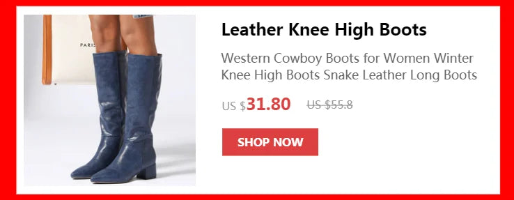Blue leather knee-high boots with pointed toes and block heels worn by a woman.