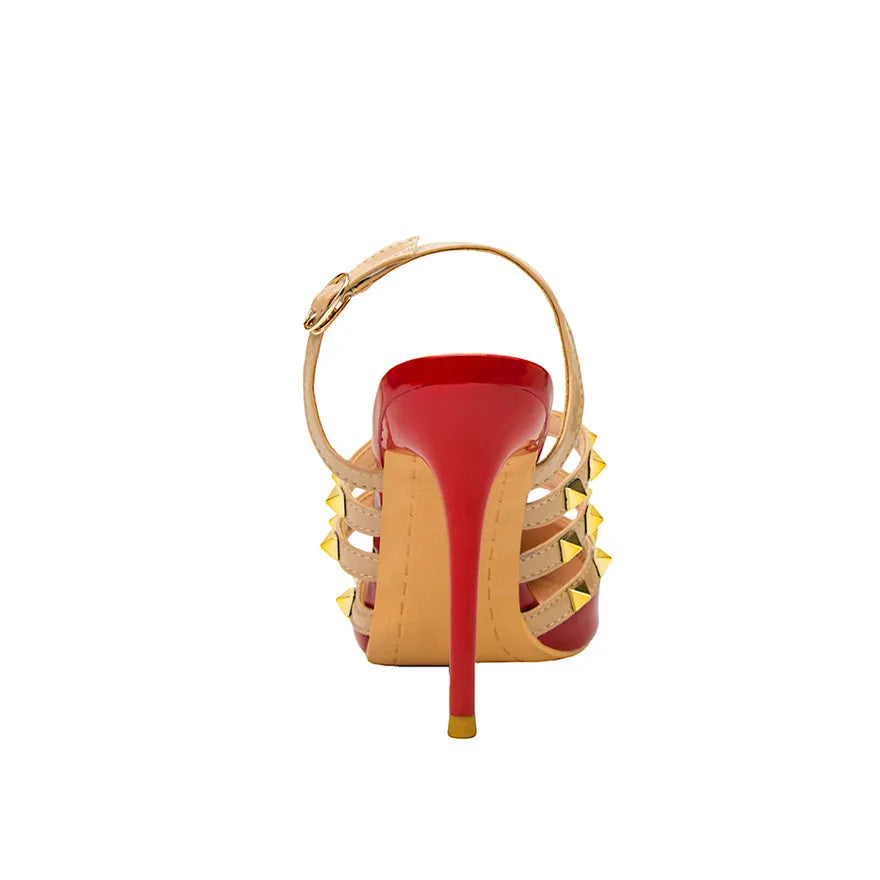 Red patent leather heel with beige caged straps, gold rivets, and ankle buckle. These strappy office dress shoes.