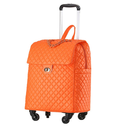 Orange quilted PU leather rolling luggage with a top flap, turn-lock closure, chain detail, and telescoping handle.