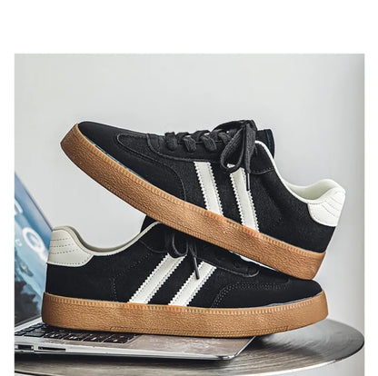 Black canvas sneakers with white stripes, white heel tabs, and gum soles, these breathable shoes are for training.