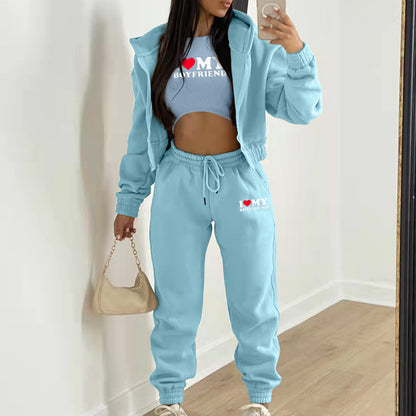 Light blue relaxed knit sweater set with hoodie, crop top, and high waist joggers for casual lounge wear.