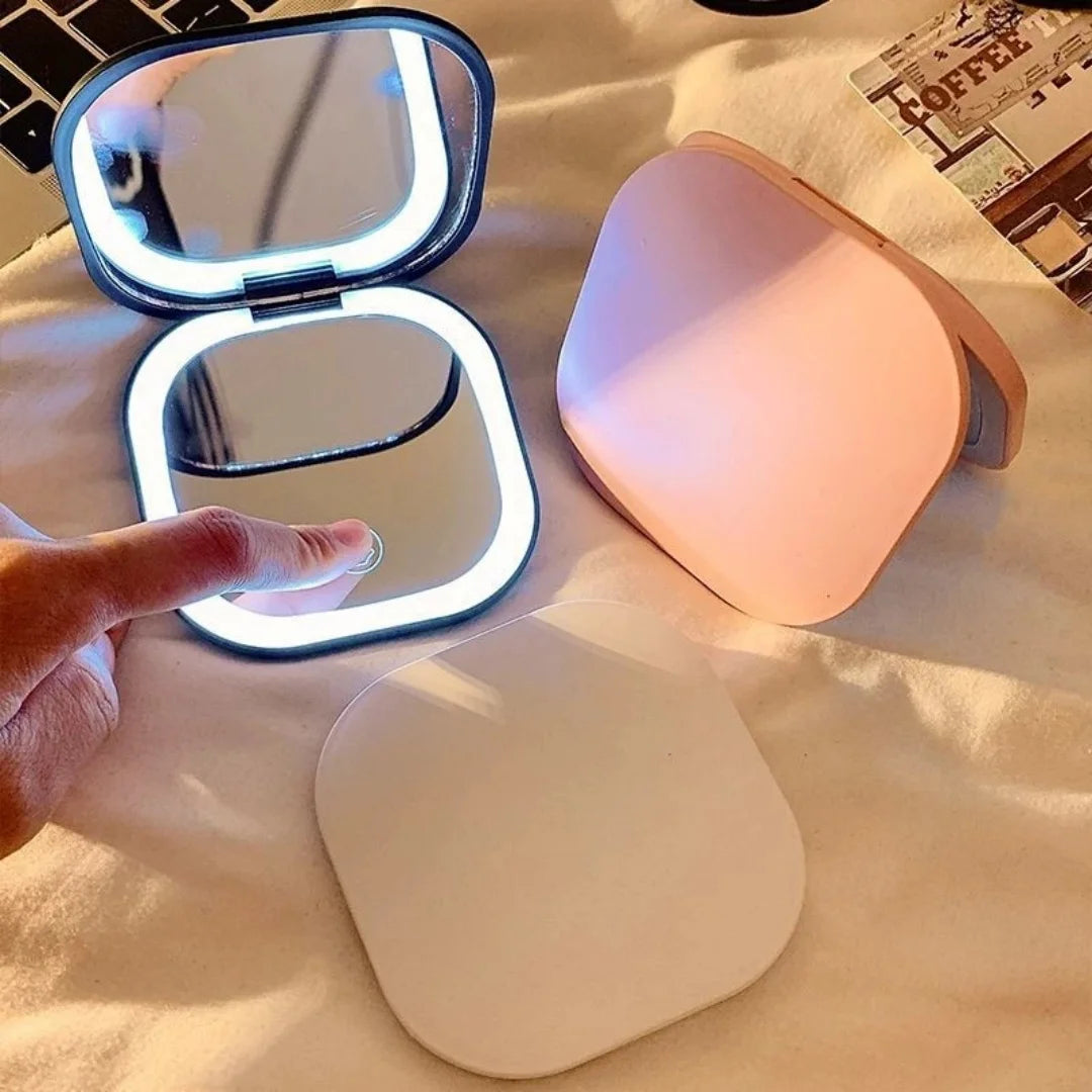 Makeup mirror with integrated LED light ring and rechargeable battery feature