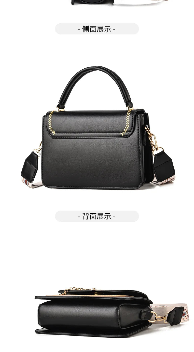 Black faux-leather shoulder bag with top handle, flap closure, gold hardware, and patterned strap.