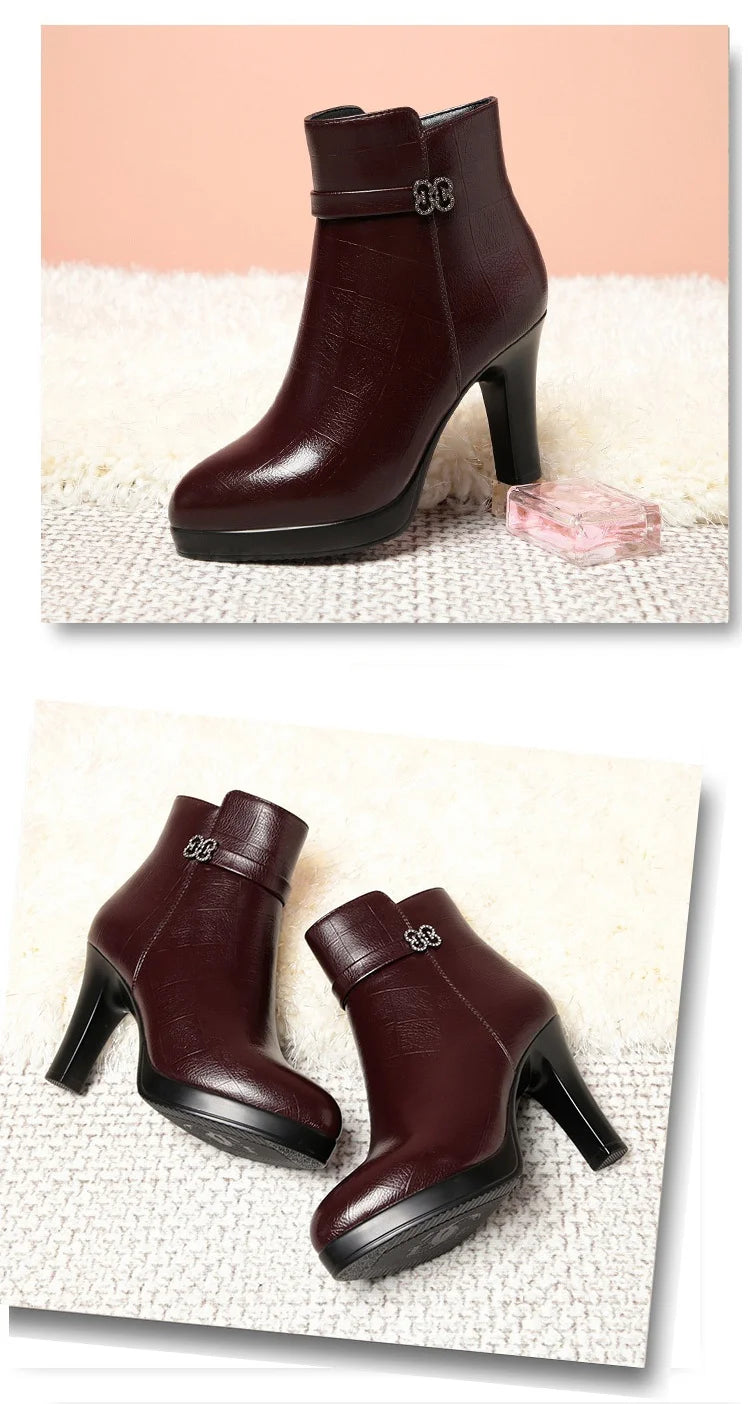 Burgundy faux-leather ankle boots with block heel, platform sole, and buckle strap detail.
