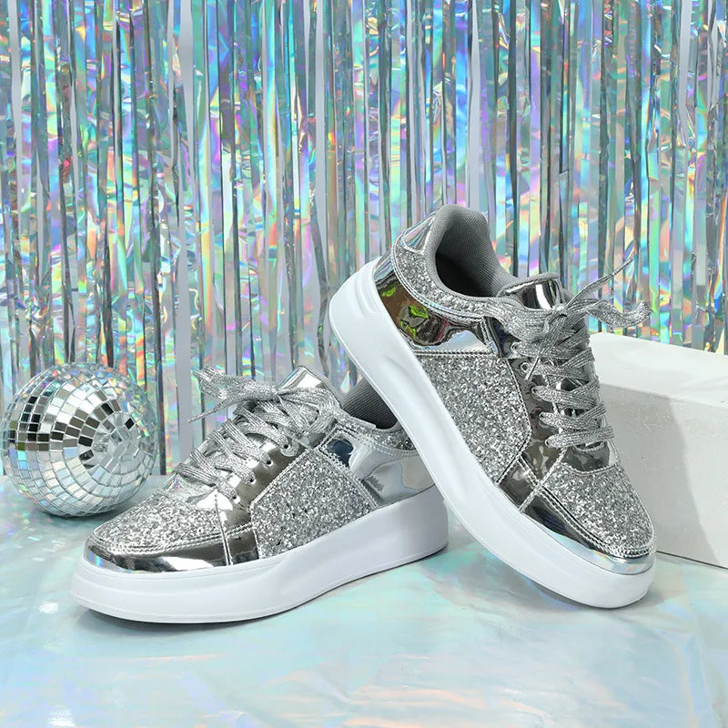 Silver sequin lace-up casual sneakers with metallic panels and thick white soles.