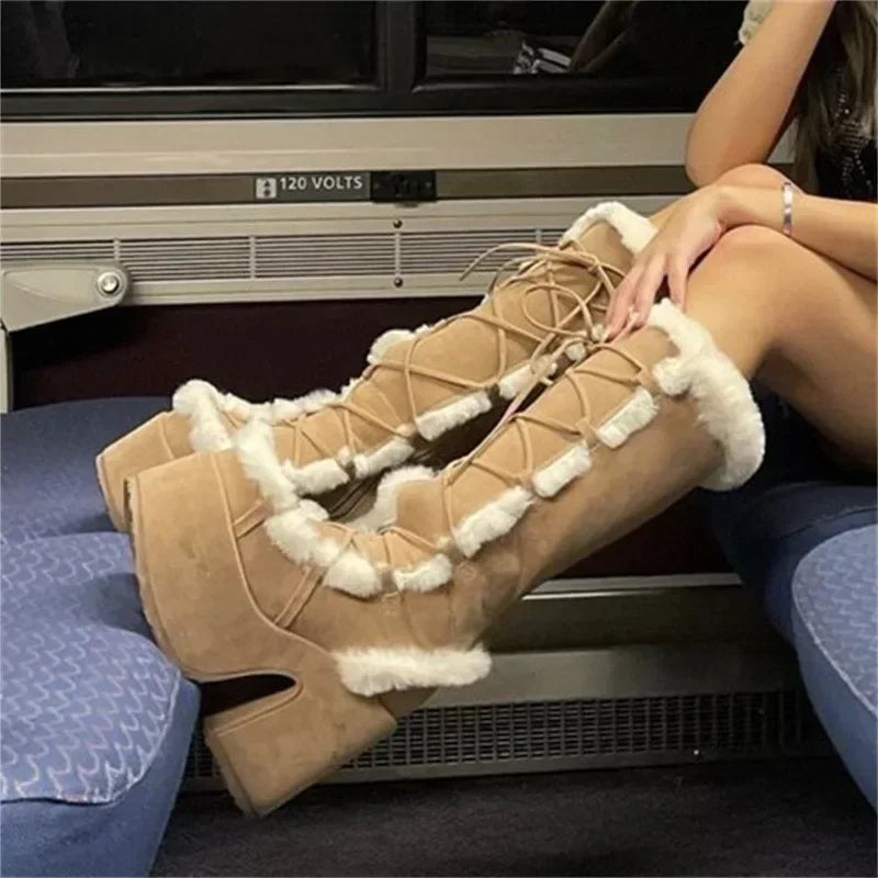 Tan suede platform wedge mid-calf boots with faux fur trim and lace-up closure.