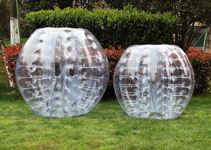 Clear TPU bumper balls with internal tether design for outdoor sports and active play on the grass.