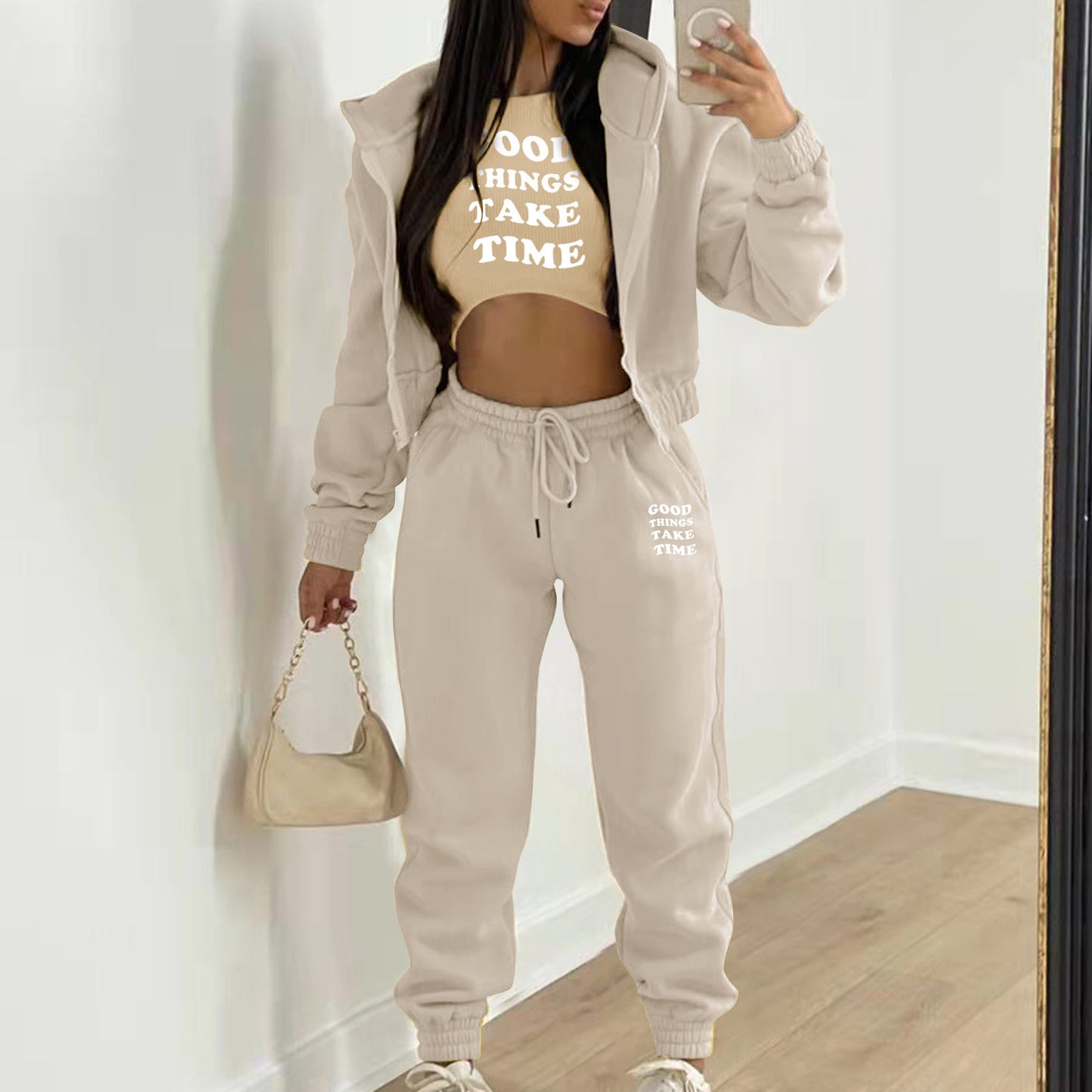 Beige plush hooded knit sweater set with white letter print and high waist joggers for a comfortable loungewear outfit.
