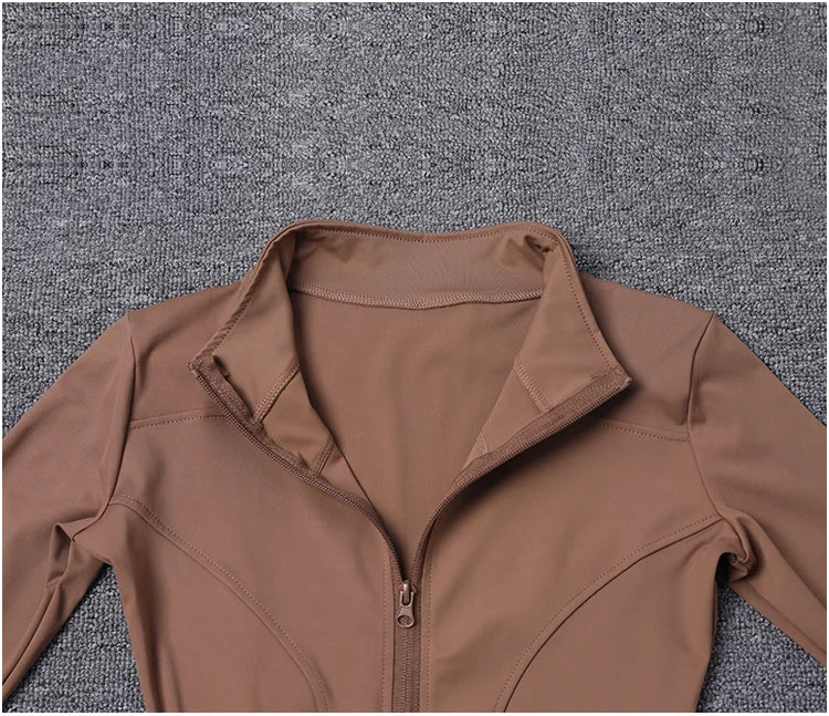 Brown polyester long sleeve sport jacket with a fitted zip-up design for gym training and yoga.