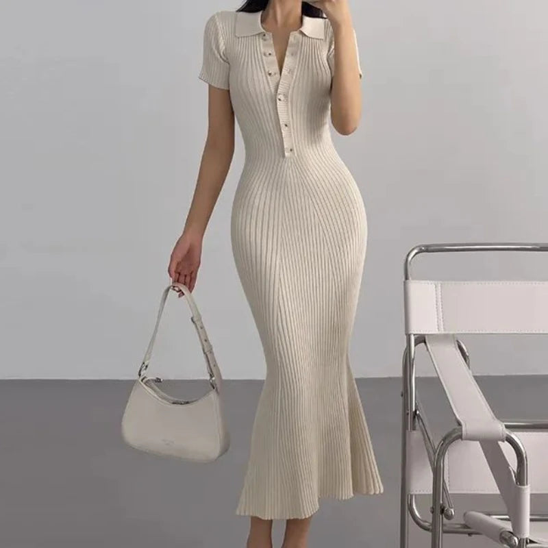 Beige ribbed knit mermaid dress with a polo collar for resort wear.