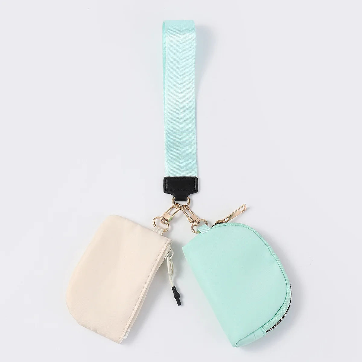 Beige and mint nylon dual pouch wristlet with zip closure for daily errands.