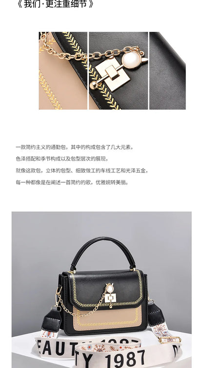 Black and beige leather handbag with gold hardware, decorative chain, top handle, and patterned strap.