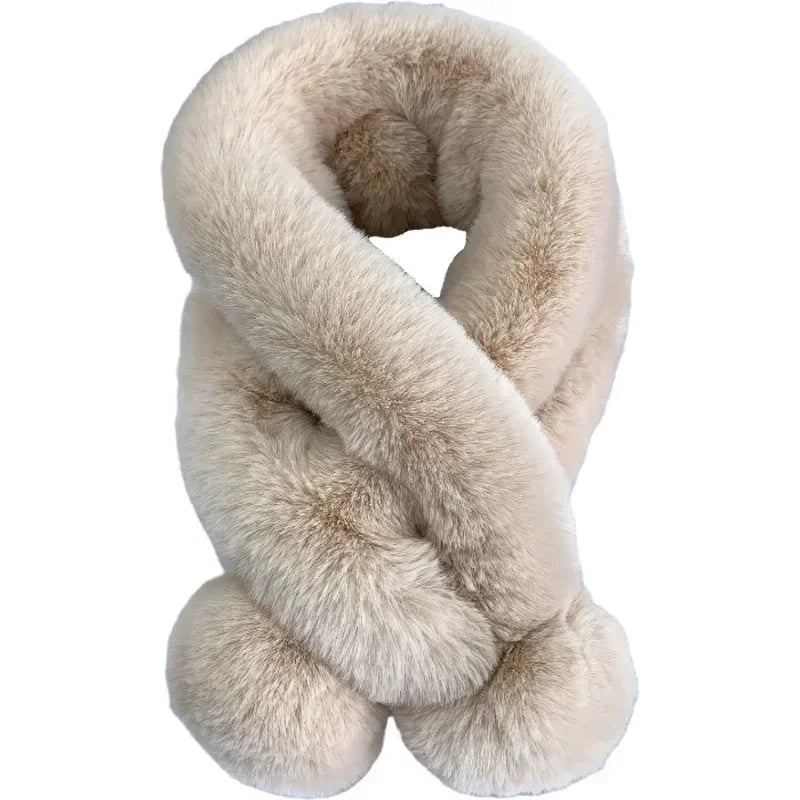 Beige plush faux-fur cross scarf with a fluffy pull-through slot and pom-pom ends.