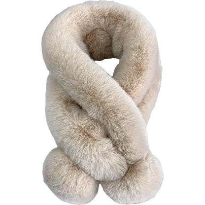 Beige plush faux-fur cross scarf with a fluffy pull-through slot and pom-pom ends.