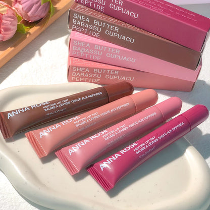 Lip glaze hydrating peptide formula in tubes with matching boxes