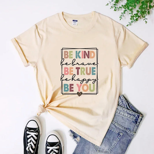 Beige t-shirt featuring box printed with be kind be brave inspirational text and short sleeves.