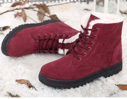 Maroon suede lace-up ankle snow boots with white faux fur lining and black flat soles.