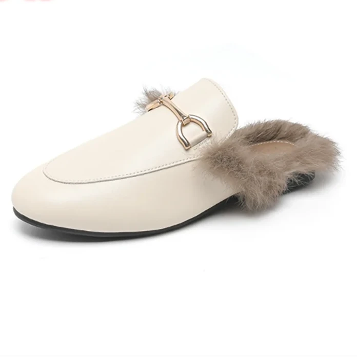 White slip-on shoe with fur trim on a white background