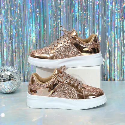 Rose gold lace-up sneakers with metallic and glitter panels, thick white soles, and matching laces.