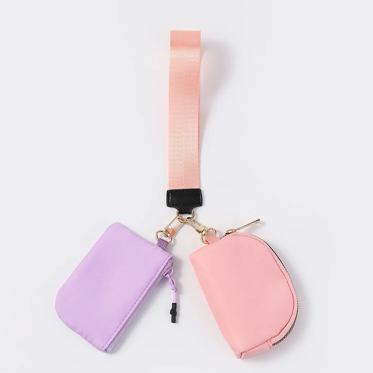 Pink and purple nylon dual pouch with a zip closure and peach wrist strap for carrying cards and keys.