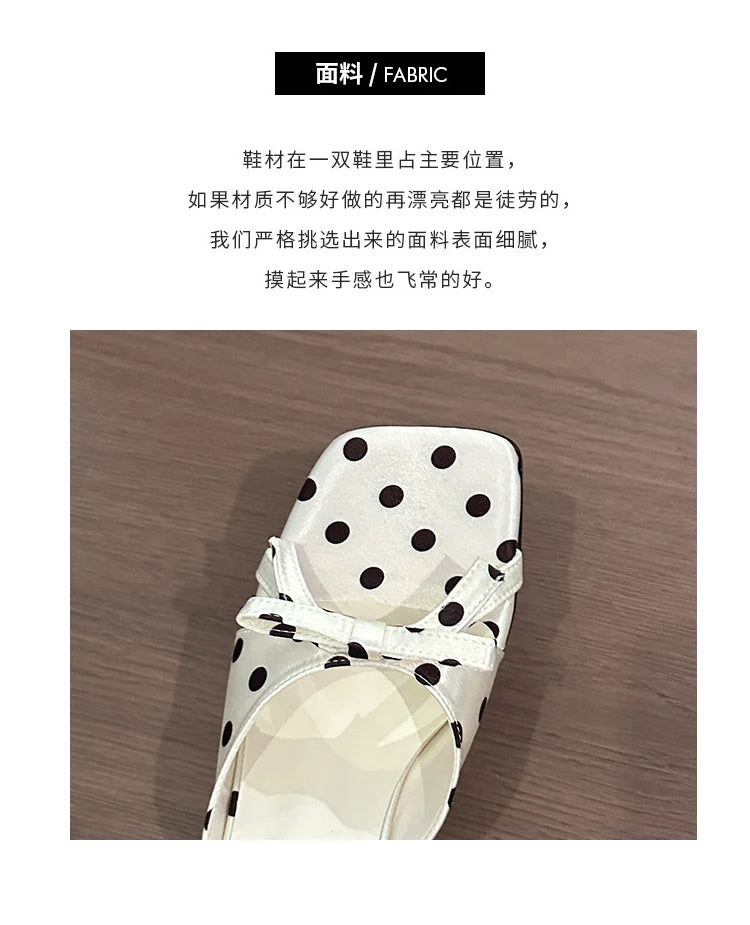 White polka dot sandal with a bow detail and cushioned insole for casual wear.