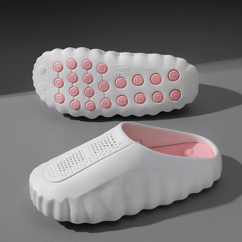 White and pink EVA slip-on sandals with cushioned massage soles and breathable perforated details.