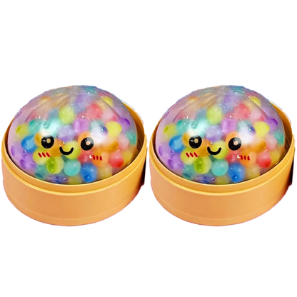 Two soft foam dumpling toys with multicolored beads, clear shells, and smiley faces, fidget toy for stress relief.