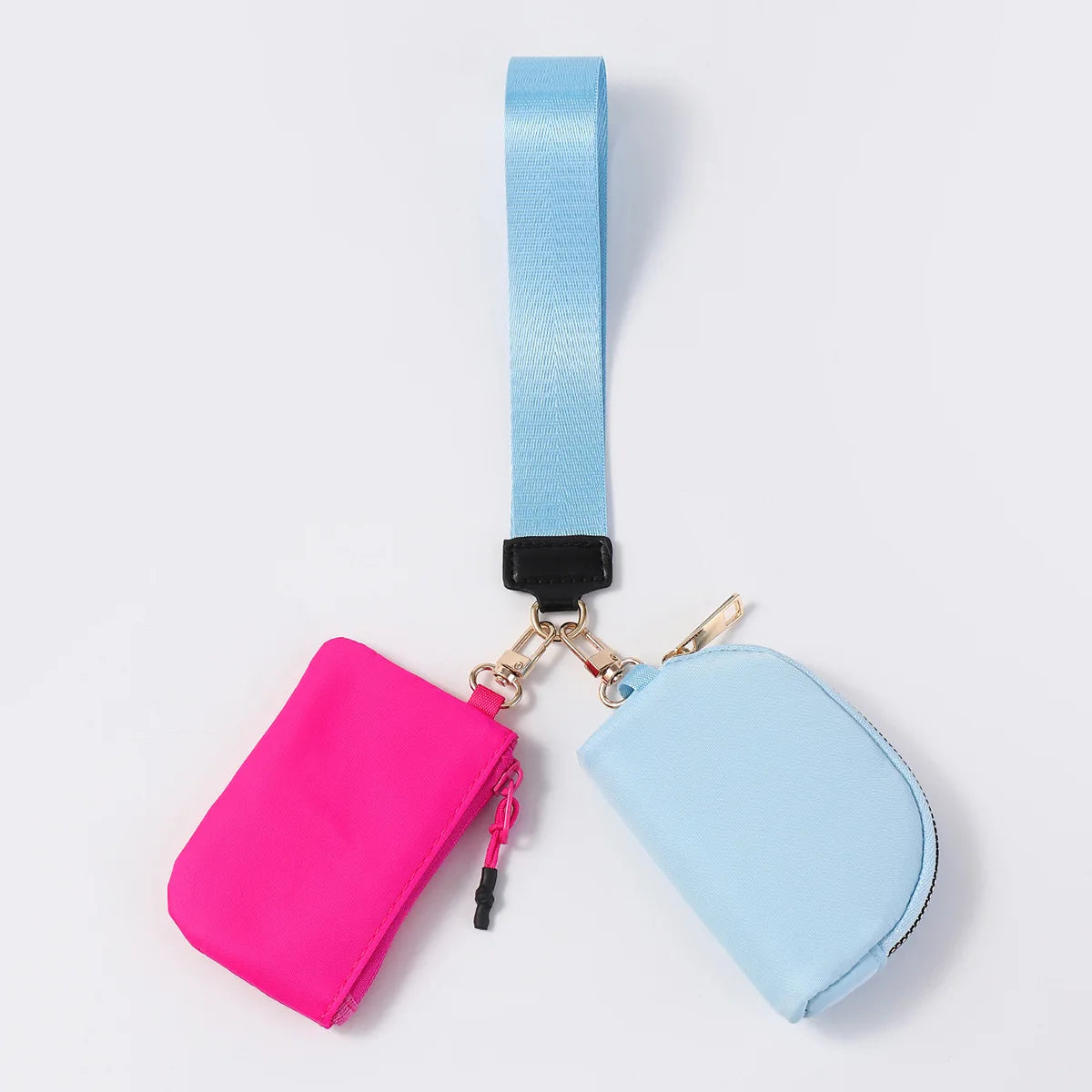 Pink and blue nylon dual pouch wristlet with zip closure for everyday errands.