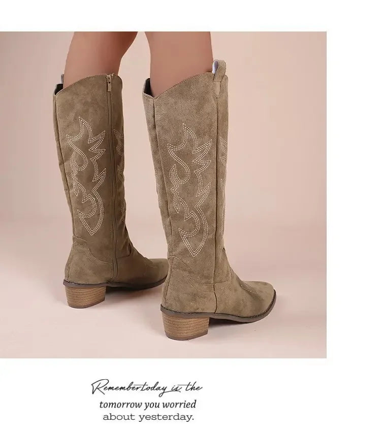 Khaki suede western cowboy boots with white embroidery, chunky heels, and mid-calf height.