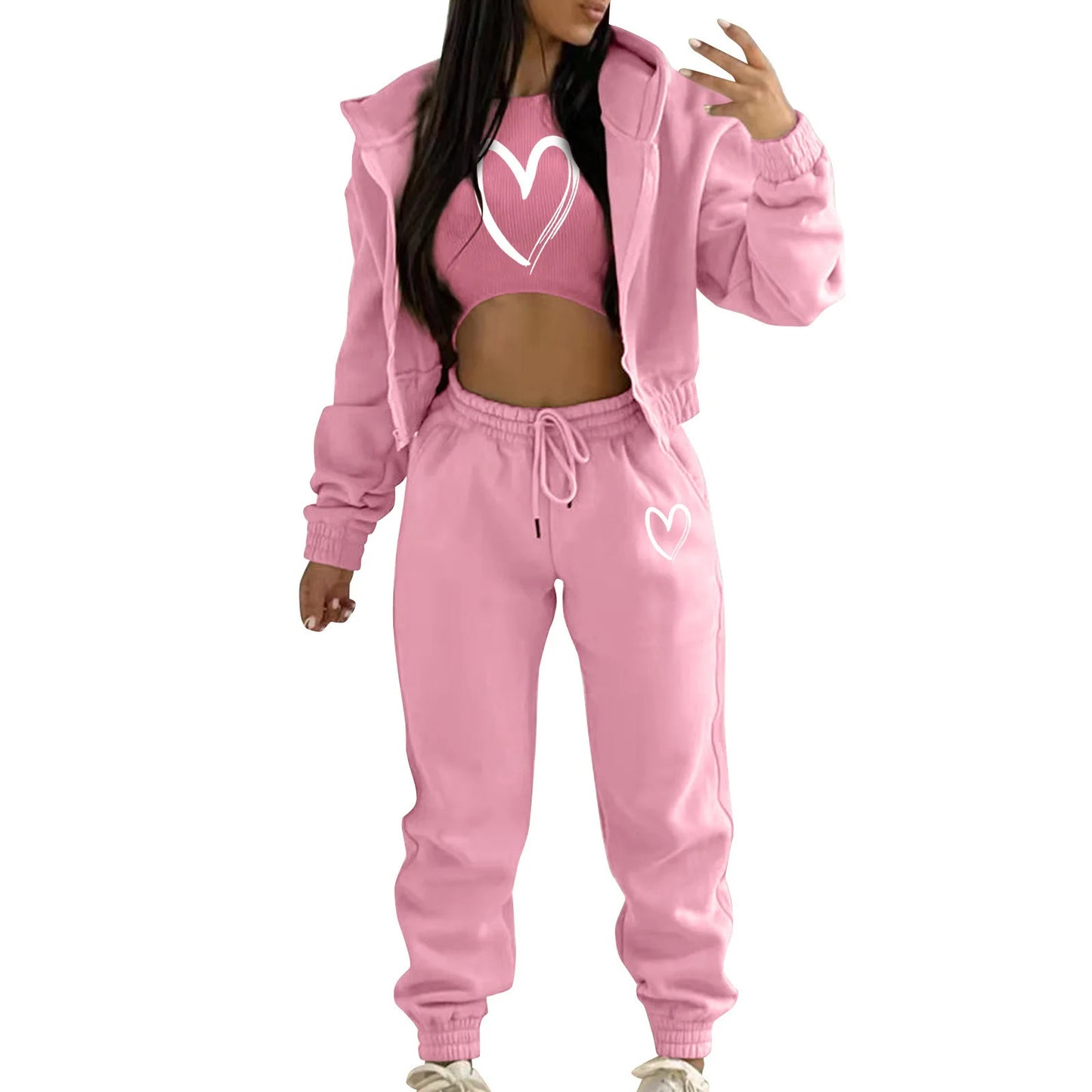 Pink knit sweater set featuring heart print and relaxed high waist joggers for loungewear.
