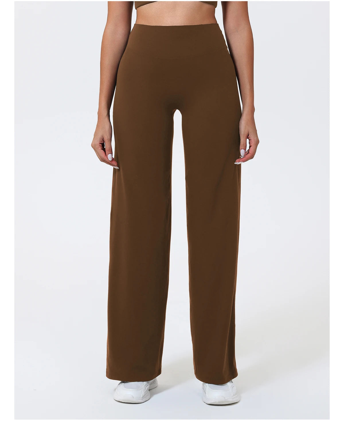Dark brown high waist sculpting leggings in a stretchy knit fabric for athletic training.