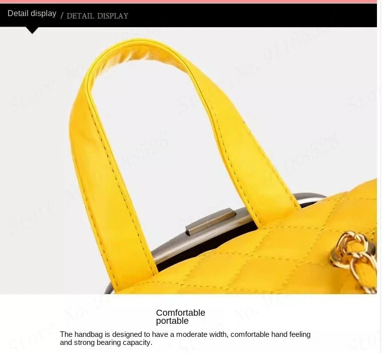 Yellow PU retro suitcase detail showing a stitched carry handle and metal closure.
