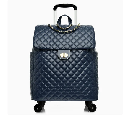 Navy quilted leather rolling suitcase with a gold chain strap, twist lock, and extendable handle.