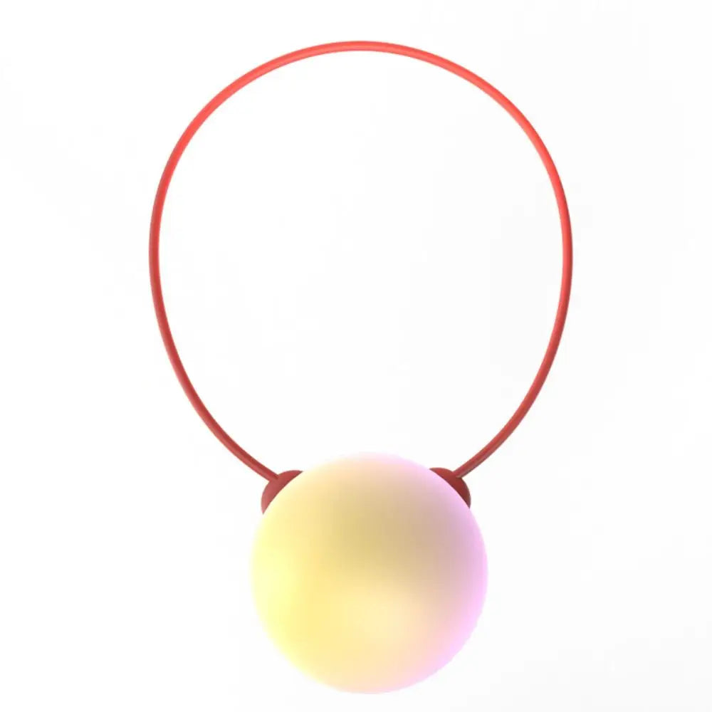Red plastic ring with a smooth iridescent sphere, an educational language learning robot toy for interactive child play.