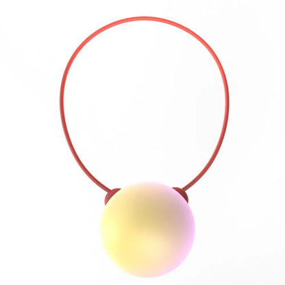 Red plastic ring with a smooth iridescent sphere, an educational language learning robot toy for interactive child play.