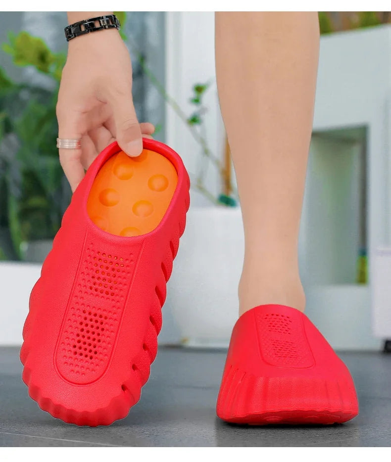 Red, perforated rubber platform sandals with a cushioned footbed for all-day comfort.