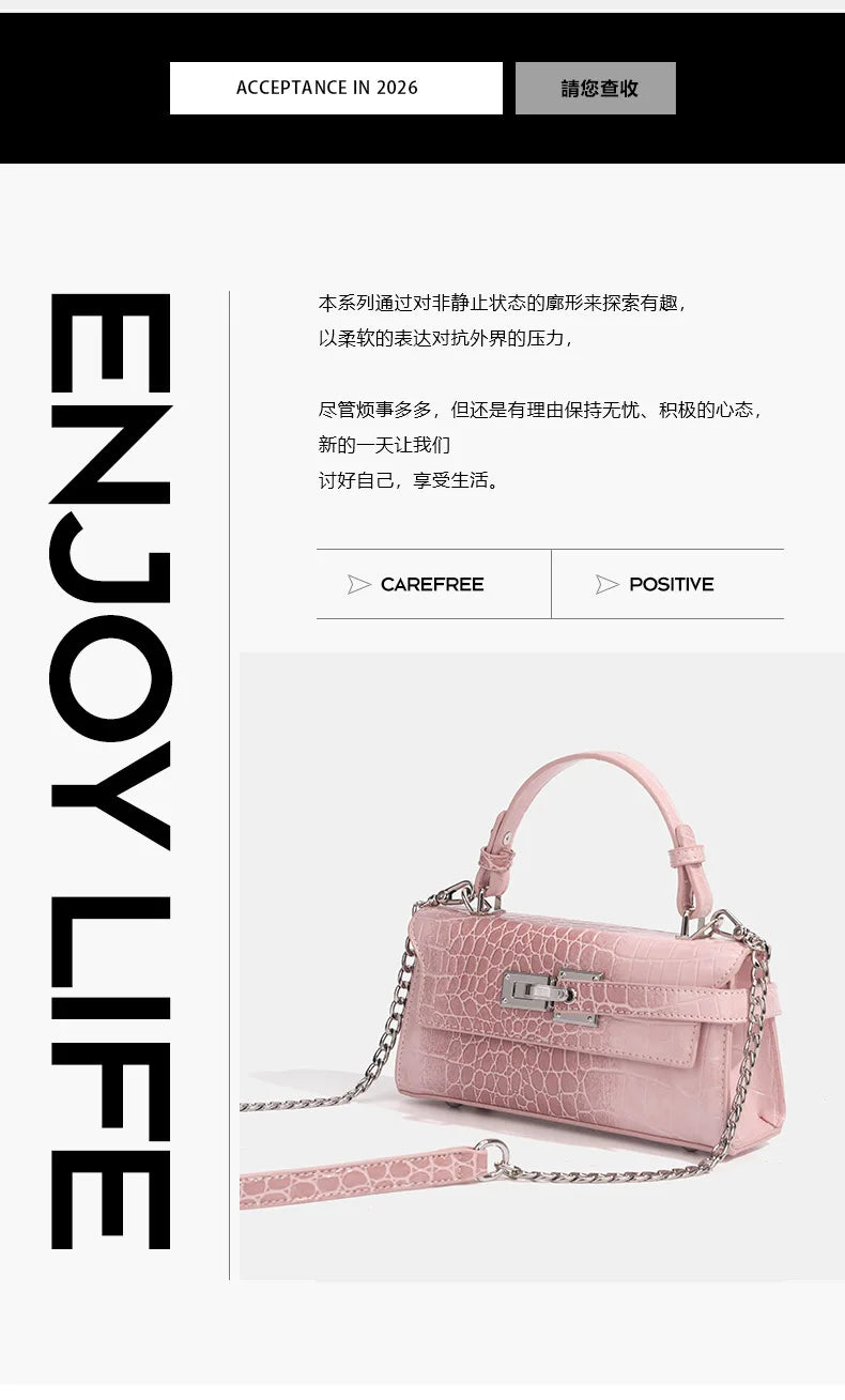 Light pink faux leather crossbody bag with structured crocodile texture, silver hardware, and chain for daily errands.