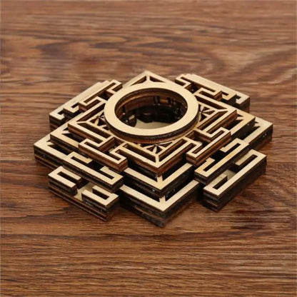 Brown wooden crystal ball stand with layered geometric lotus patterns and a central circular holder.
