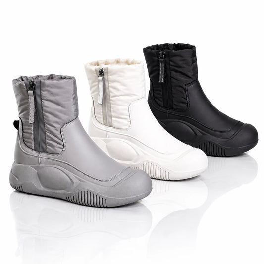 Three winter boots in grey, white, and black with quilted shafts and side zippers.