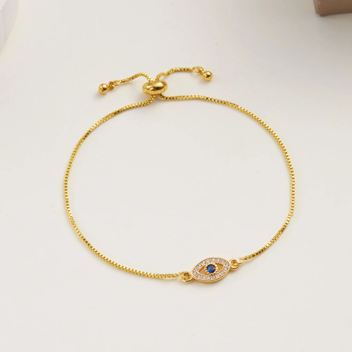 Bracelet with a heart-shaped zircon evil eye charm
