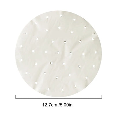 Round white paper steamer liner with evenly spaced perforation holes, measuring 12.7cm / 5.00in across.