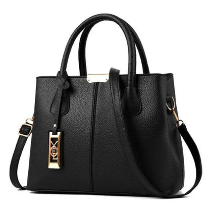 Black faux leather structured tote bag with zip closure and adjustable strap for everyday use.