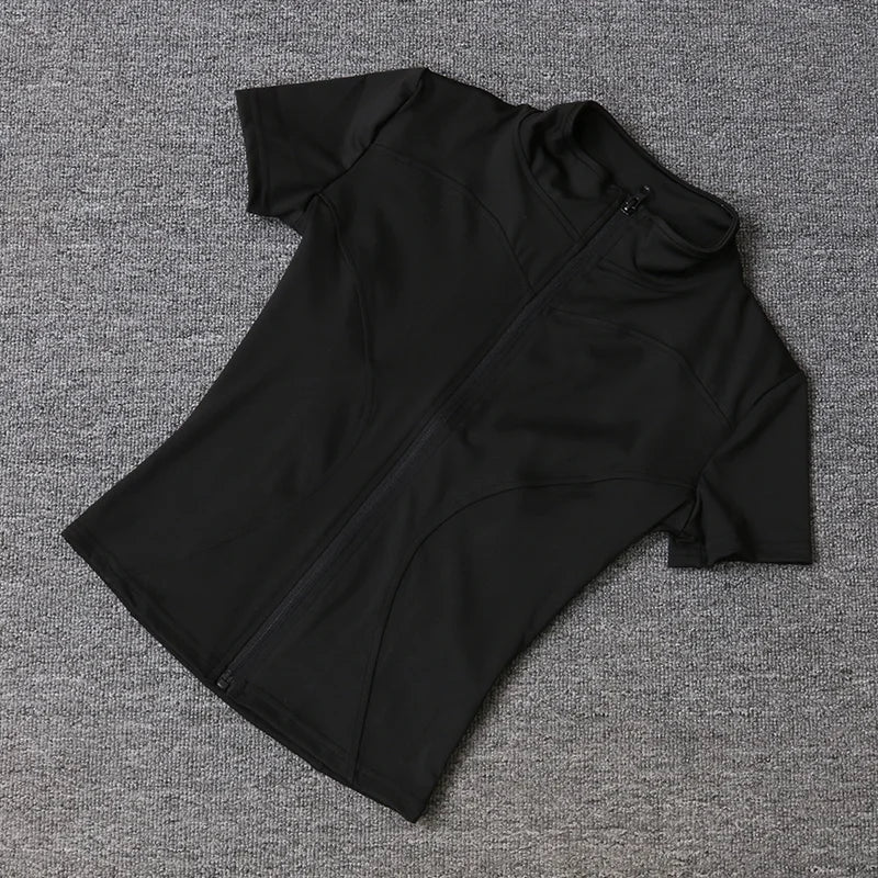 Black short-sleeve fitted training top with a full-zip front, stand collar, and sculpting seams for yoga.
