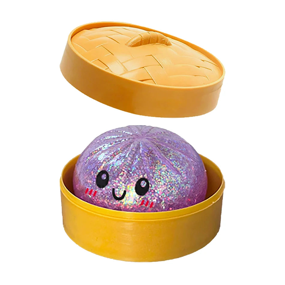 Purple glittery squishy dumpling toy with a happy face in a yellow plastic steamer pot for stress relief fidget toy.