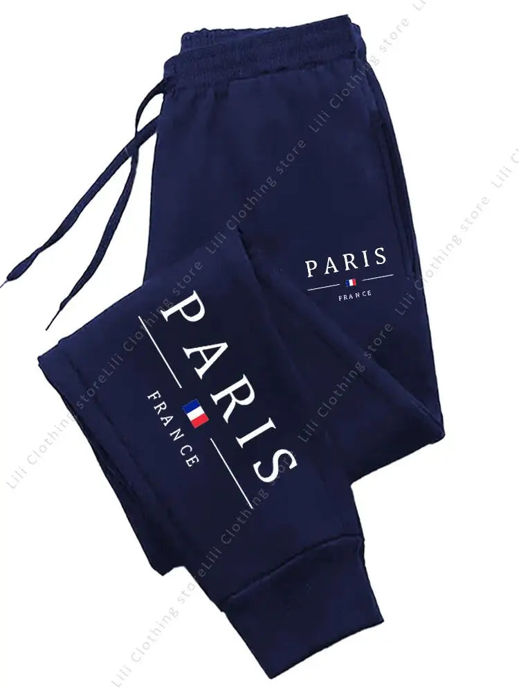 Navy blue fleece-lined stretchy joggers with Paris graphic for lounge wear.