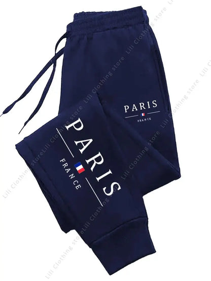 Navy blue fleece-lined stretchy joggers with Paris graphic for lounge wear.
