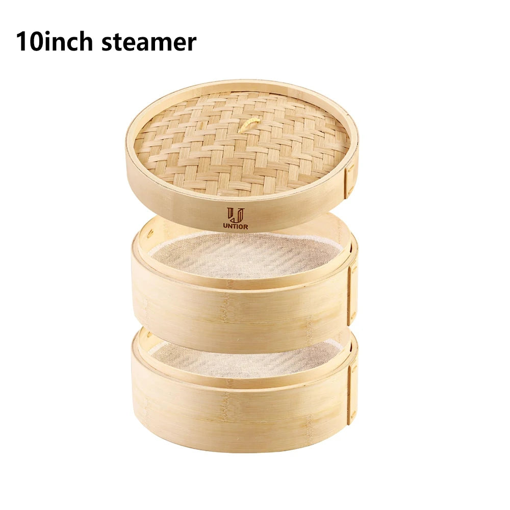 Stacked natural bamboo dumpling steamer with two tiers, mesh liners, and a lid featuring a woven top.