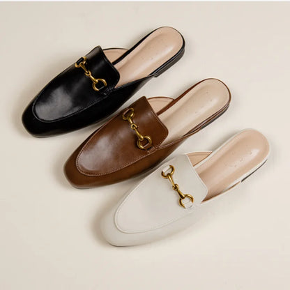 Black, brown, and beige slip-on mules with gold chain detail, wear these cushioned shoes for comfortable daily errands.
