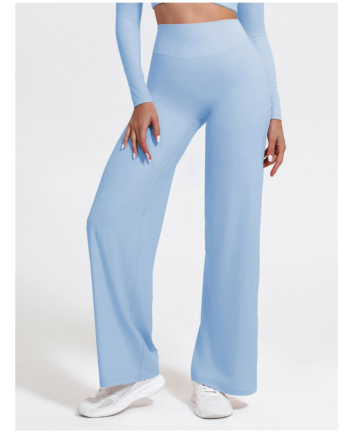 Light blue high waist sculpting compression leggings in a stretchy knit fabric for yoga or gym workouts.